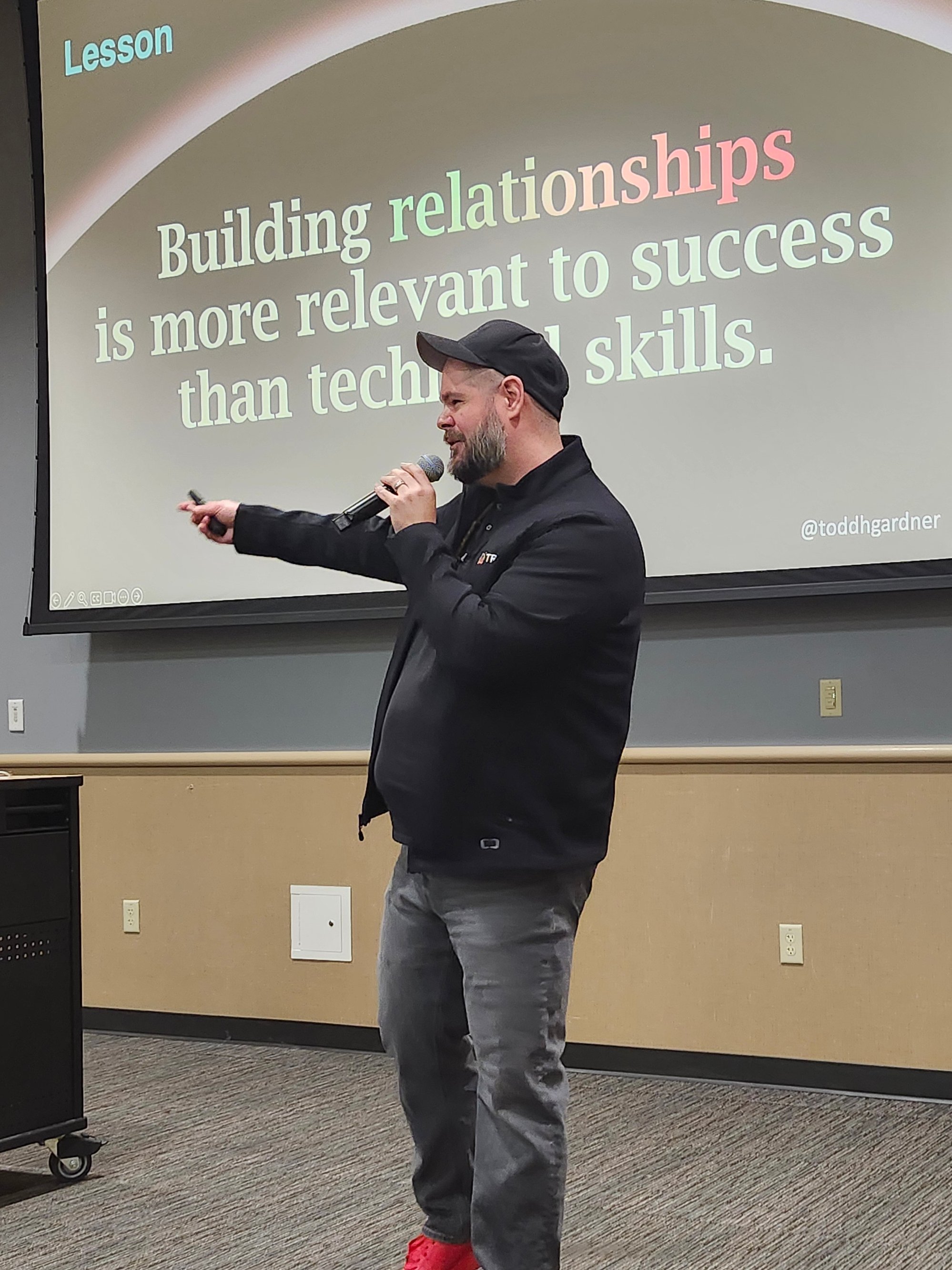 Todd in front of his slide &lsquo;Building relationships is more relevant to success than technical skills.